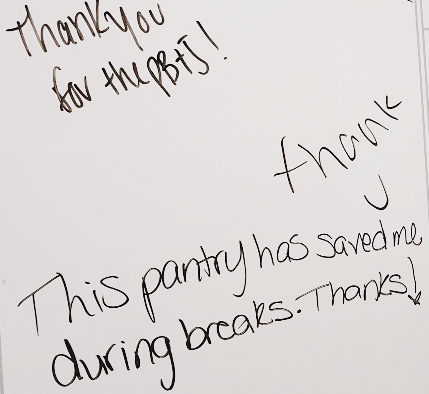  Students leave thank you notes on the whiteboard behind the door in Mo’s Cupboard.