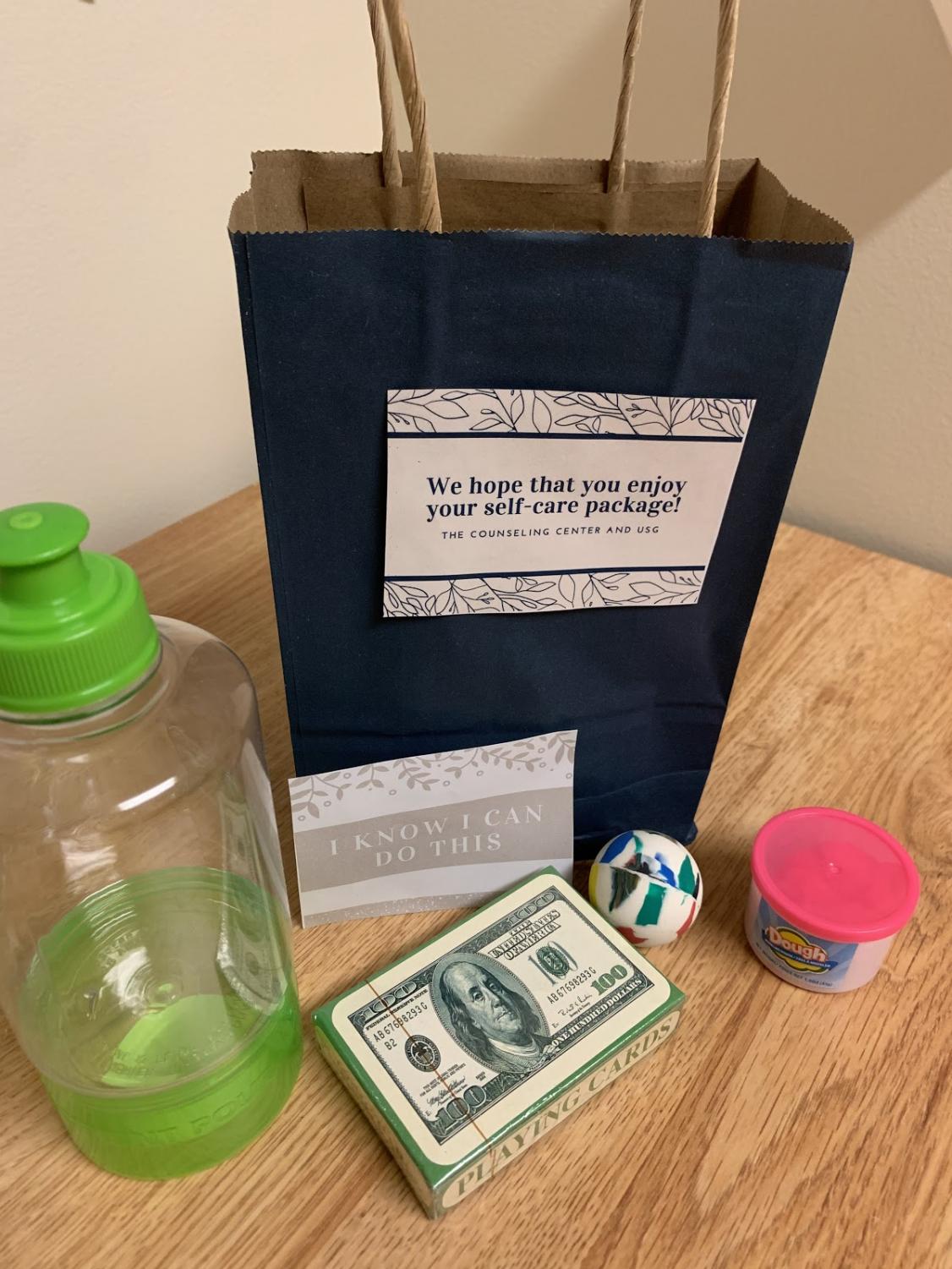 Counseling Center’s care package to students (included: playing card deck, an iteration of Play-Doh, a water bottle with a snack compartment, bouncy ball, etc.)