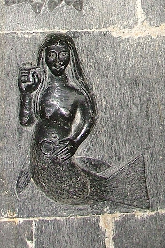 The Clonfert Mermaid, a medieval carving of a female Merrow, from Wikimedia Commons