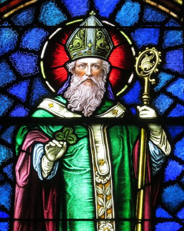 (A Stained Glass portrayal of Saint Patrick, depicted as a bishop, holding a Shamrock, from Wikimedia Commons, photo by Nheyob - Own work, CC BY-SA 4.0, https://commons.wikimedia.org/w/index.php?curid=39732088)