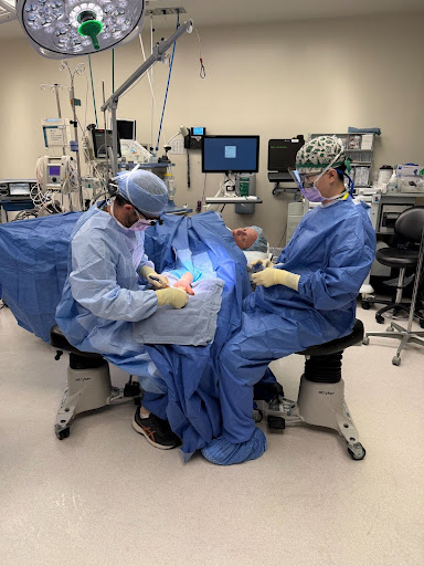 Photo from Hassaan Naveed. Pictured: Dr. Sibley on left; Dr. Traupman-Carr on Table, Trigger Finger Release.